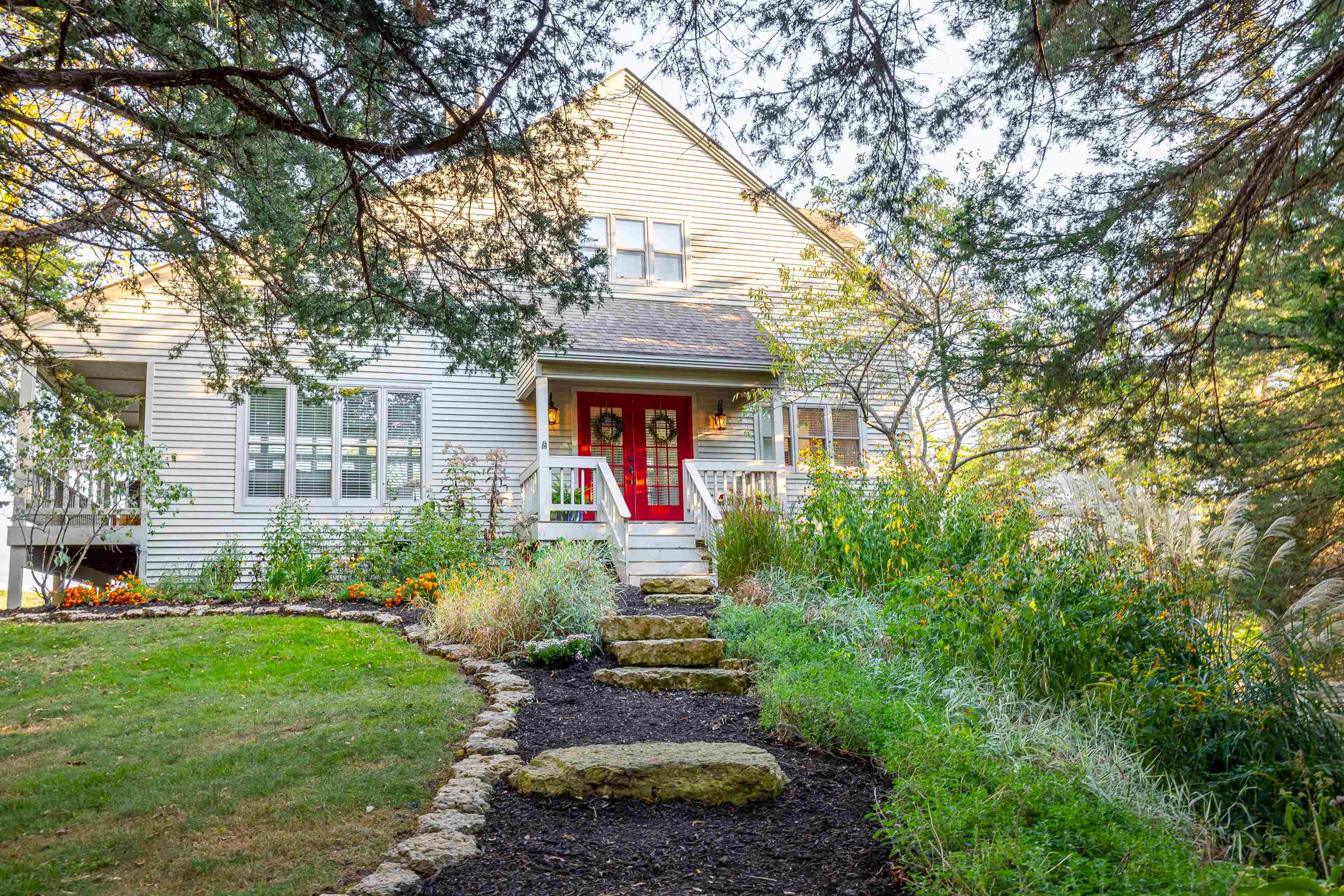 a front view of house with yard and green space