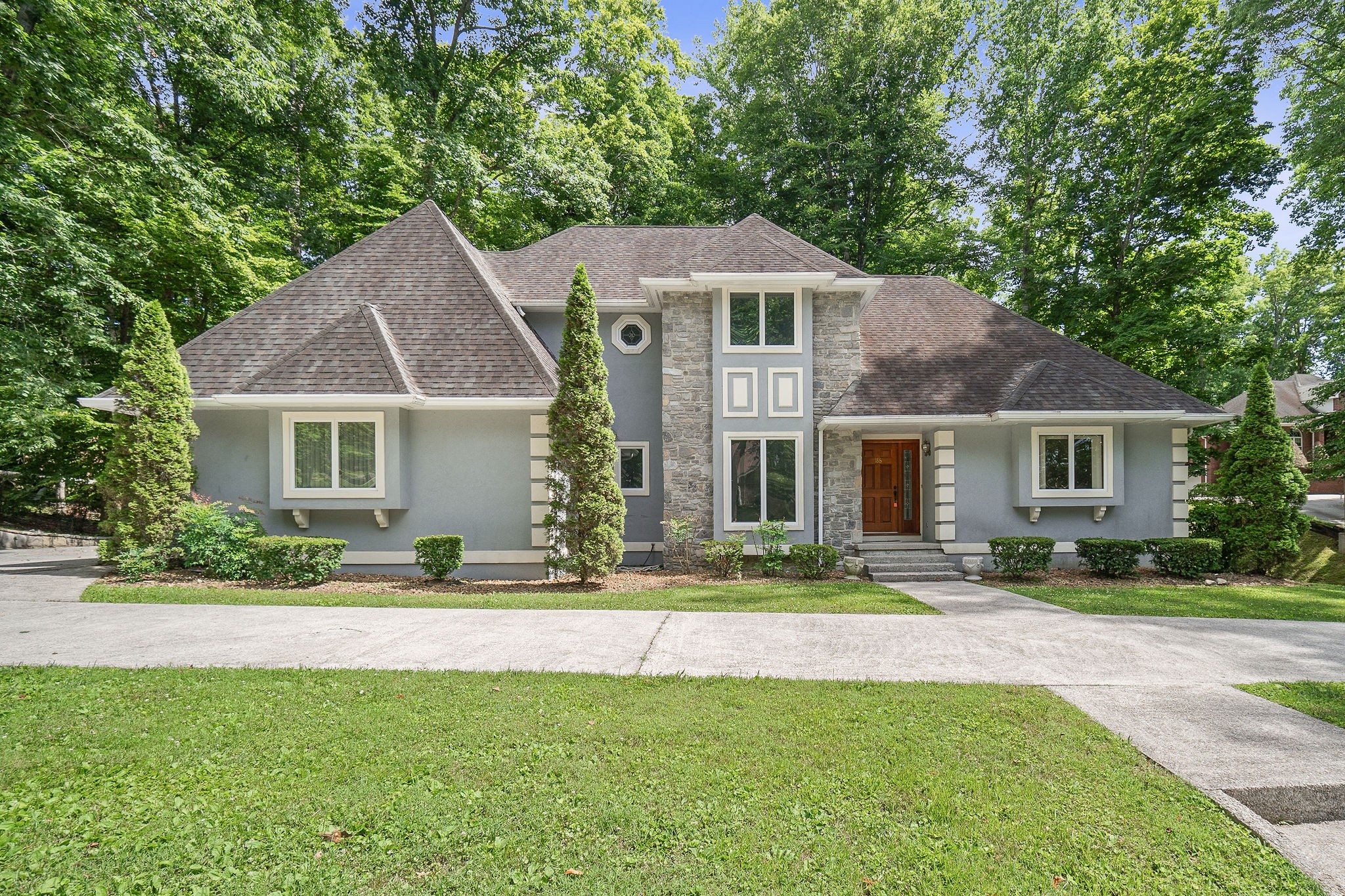 a front view of a house with a yard