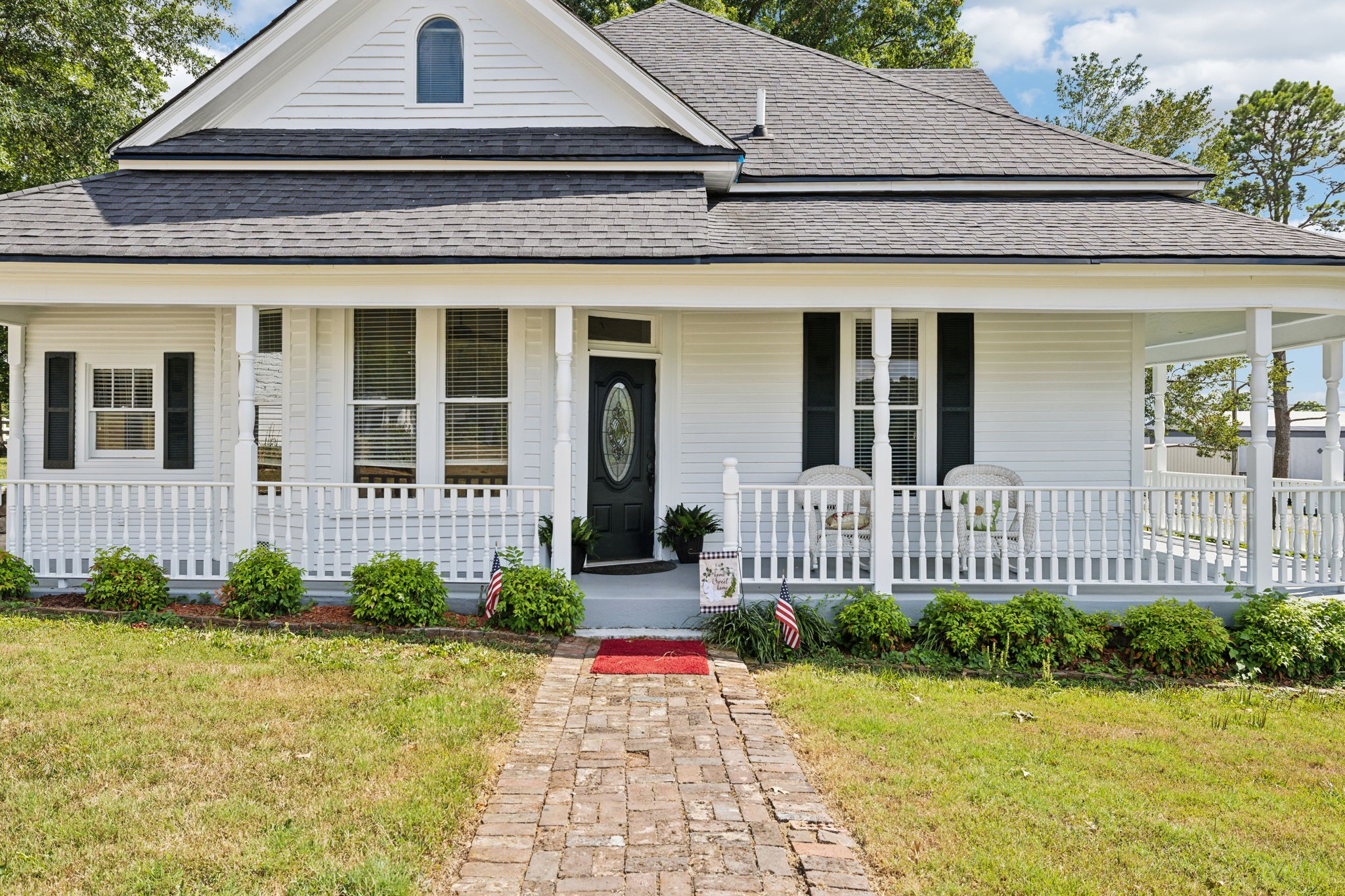 a front view of a house with a yard