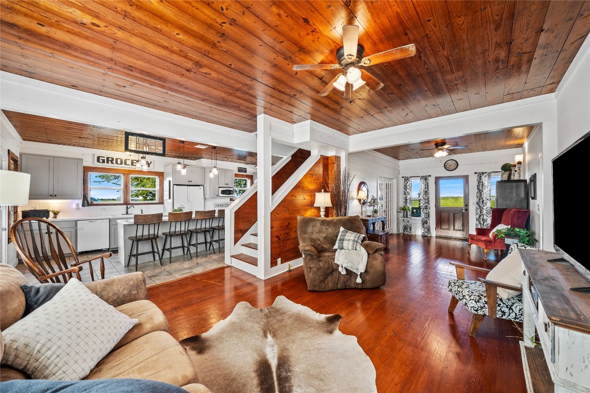 a bedroom with furniture and wooden floor