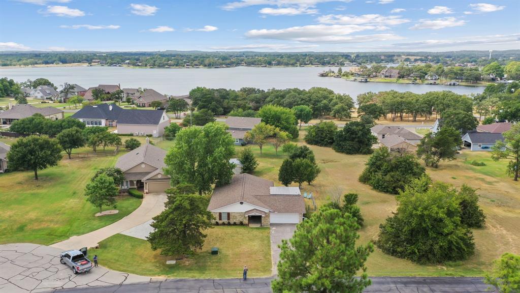 an aerial view of a city with lots of residential buildings lake and ocean view