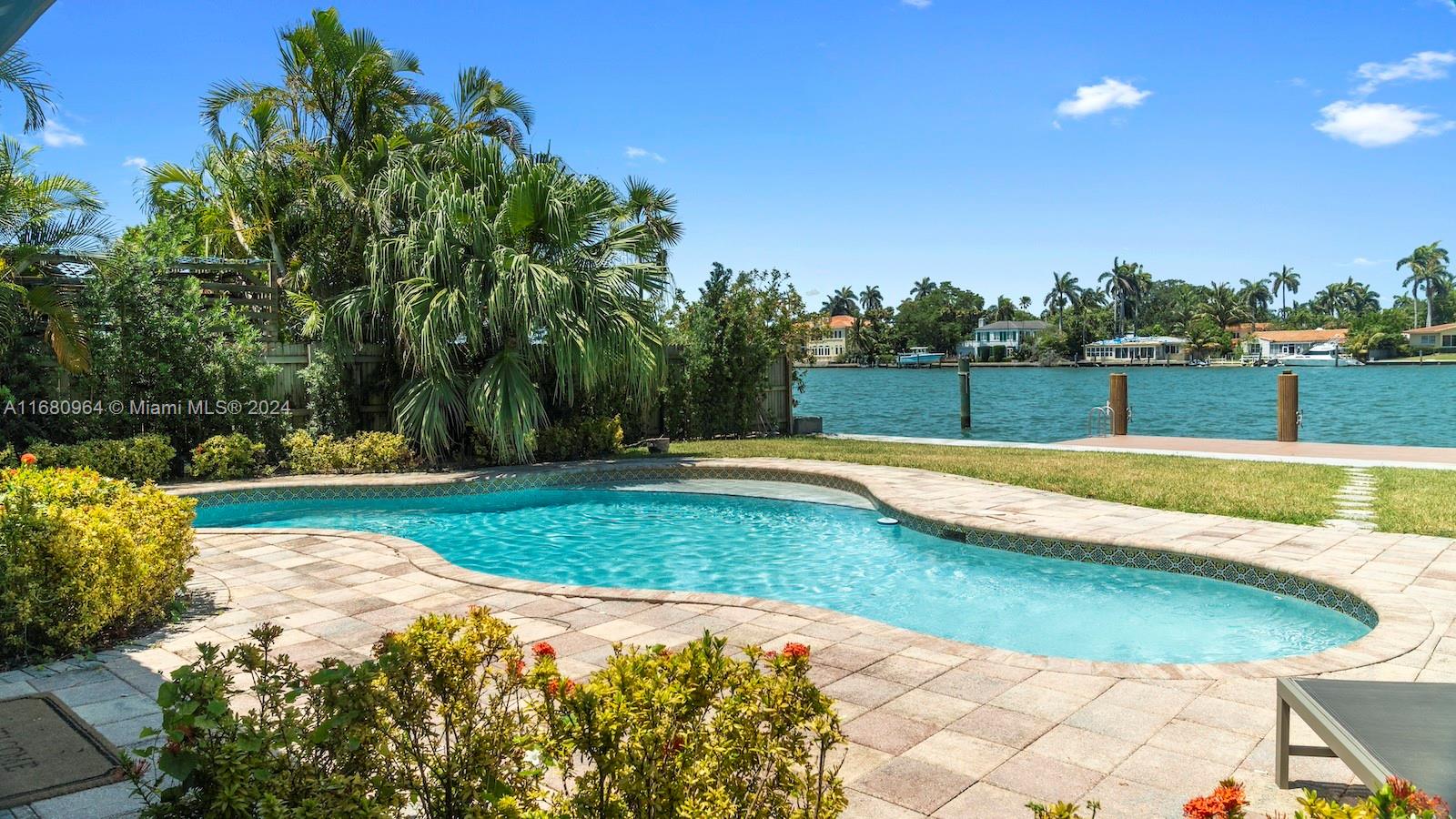 a view of swimming pool with a yard