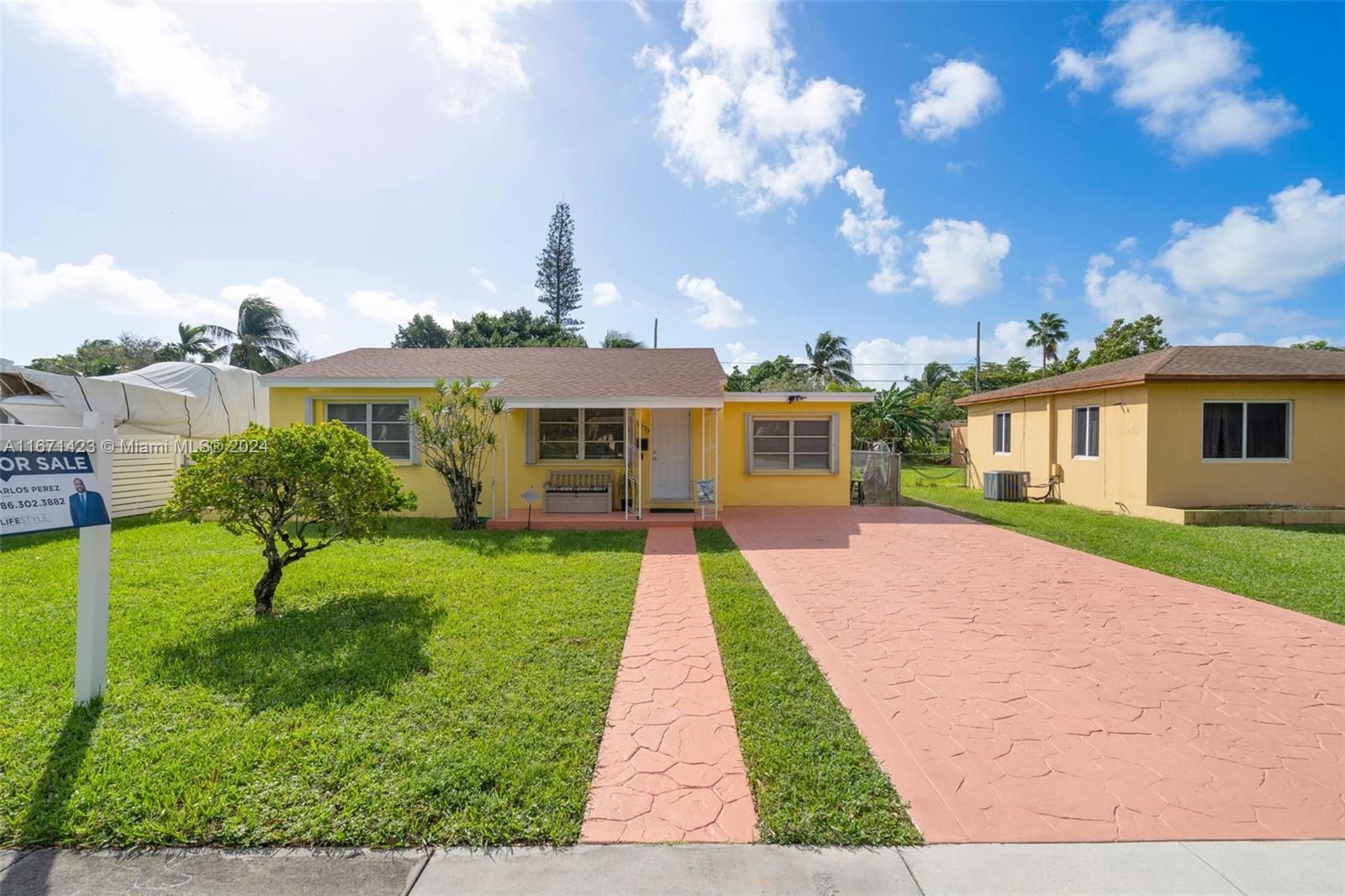 a front view of a house with yard