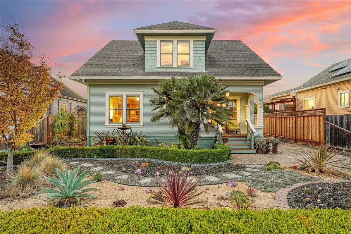 a front view of a house with garden