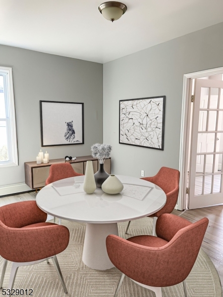 a dining room with furniture and window