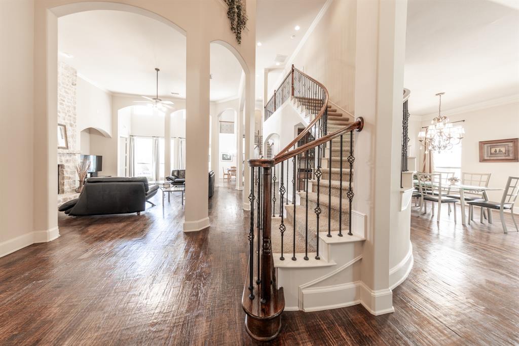 a view of a living room and floor to ceiling window kitchen