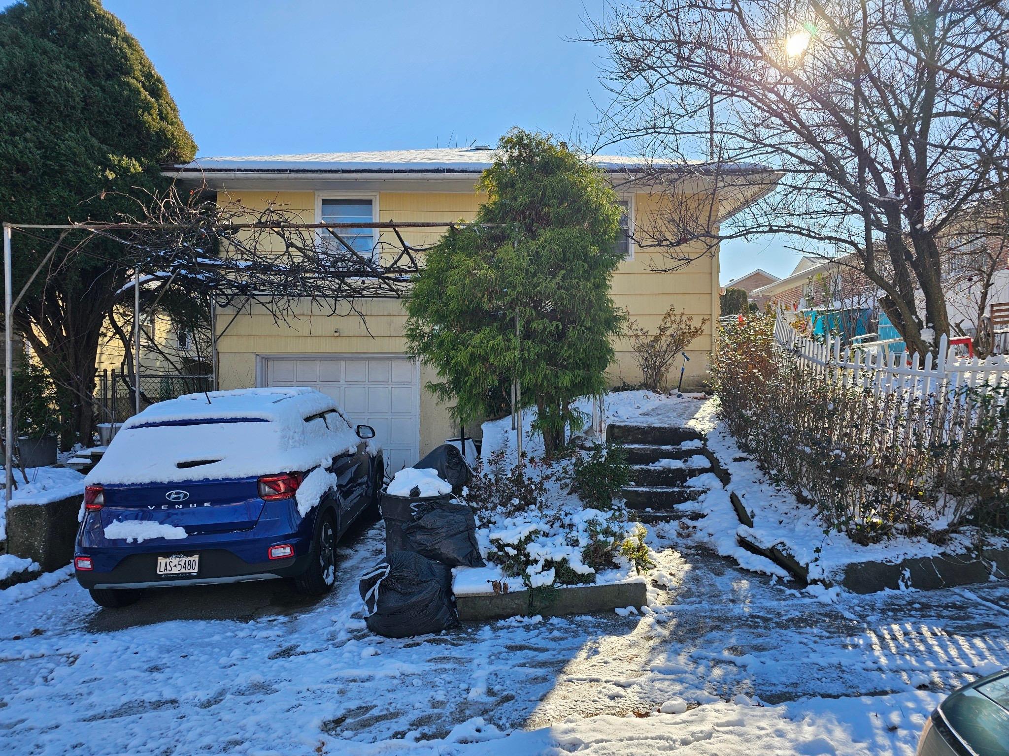 View of front of home featuring a garage