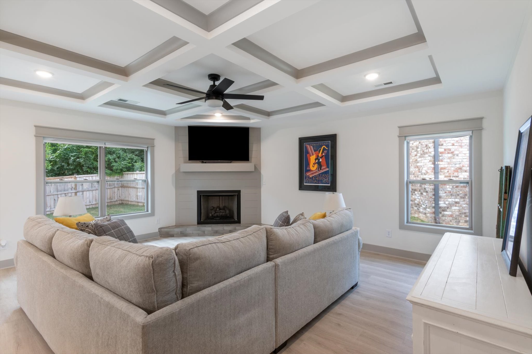 a living room with furniture and a fireplace