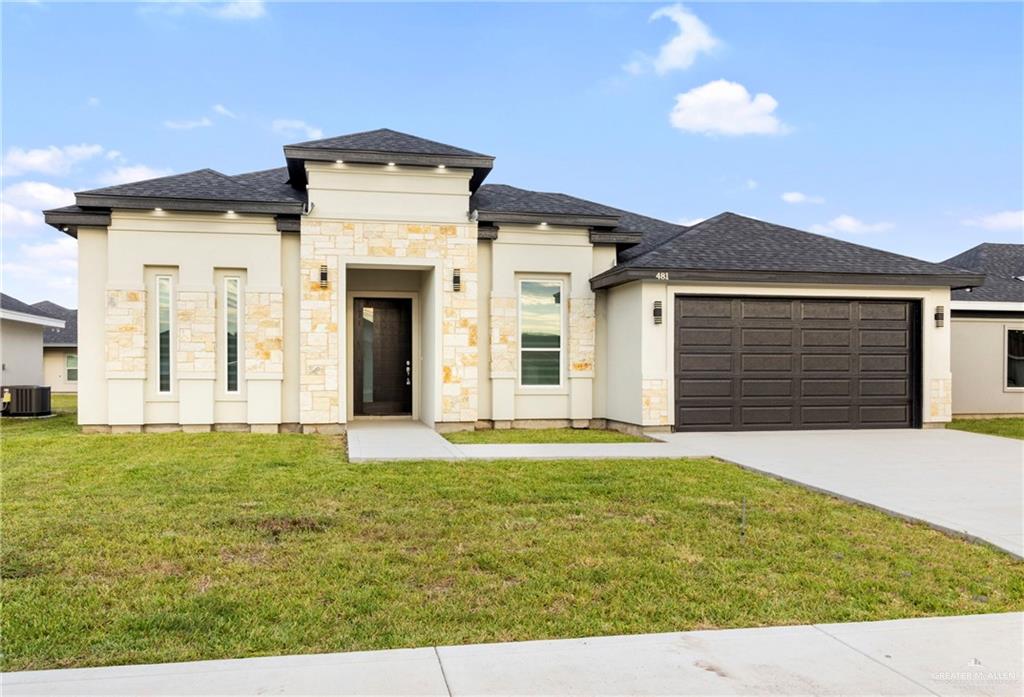 a front view of a house with a yard