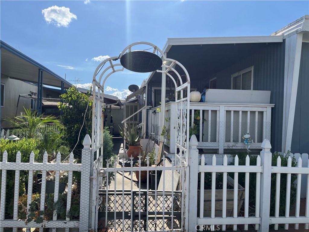 a view of a house with wooden deck