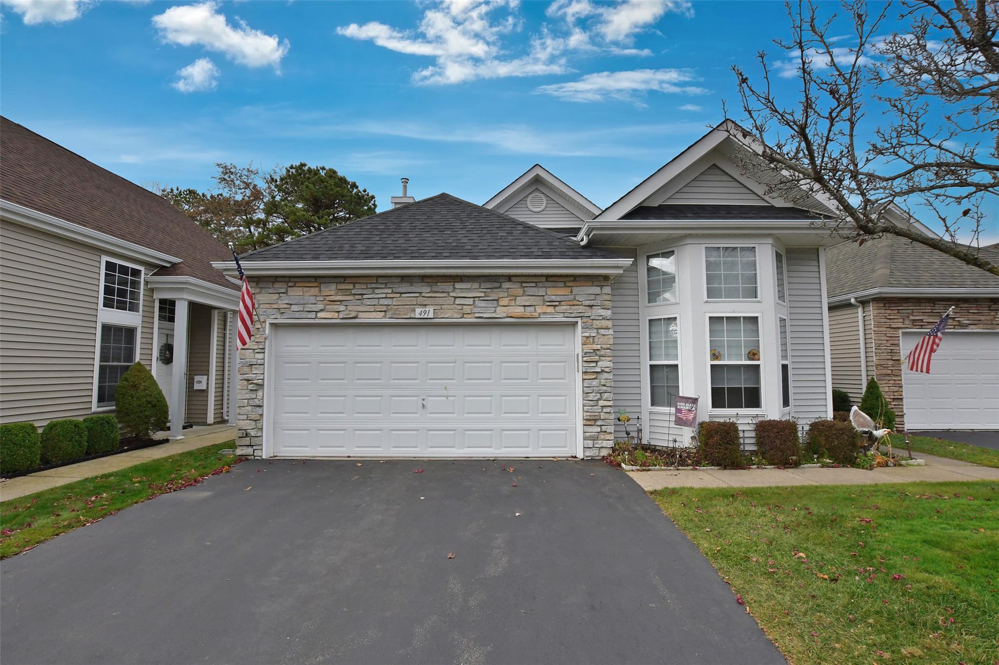 View of front of property featuring a garage