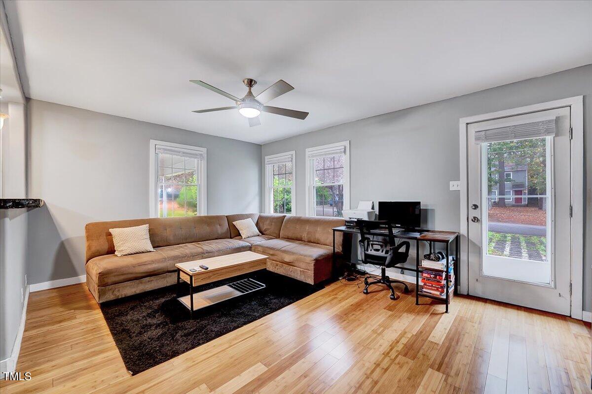 a living room with furniture and a flat screen tv