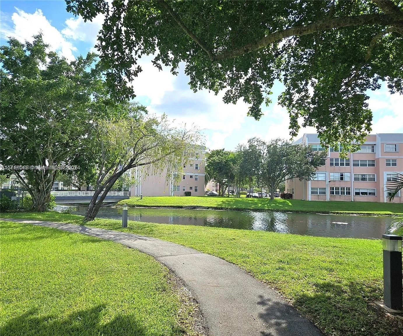 a view of a park with large trees