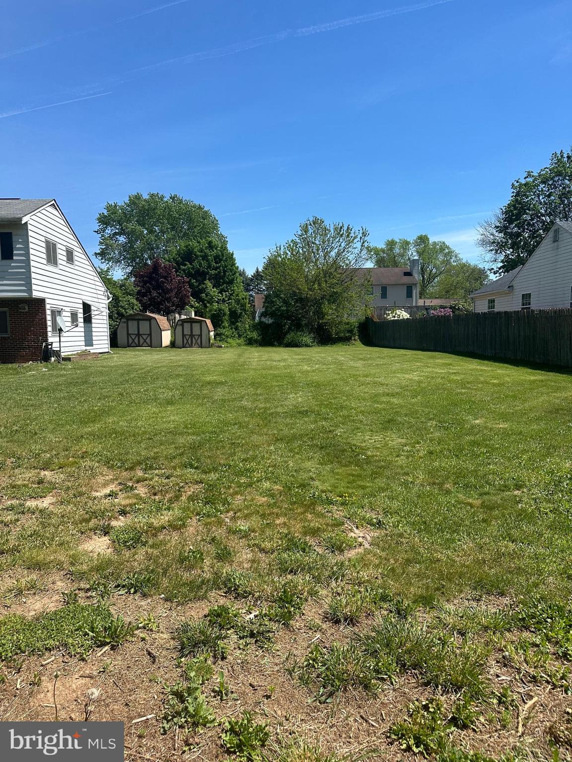 a view of a big yard with a house