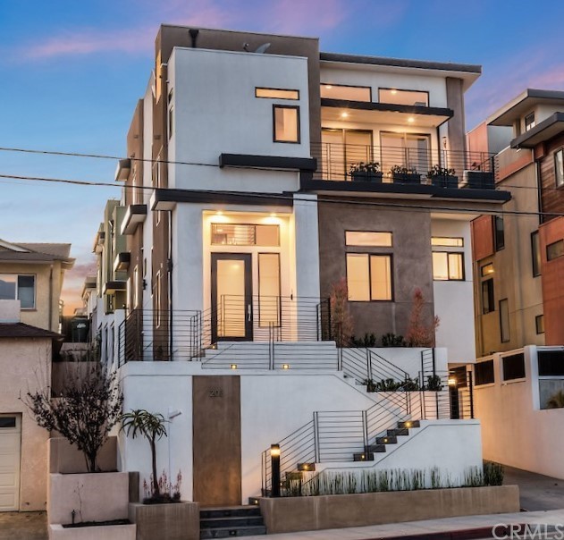 a front view of a residential apartment building with a yard