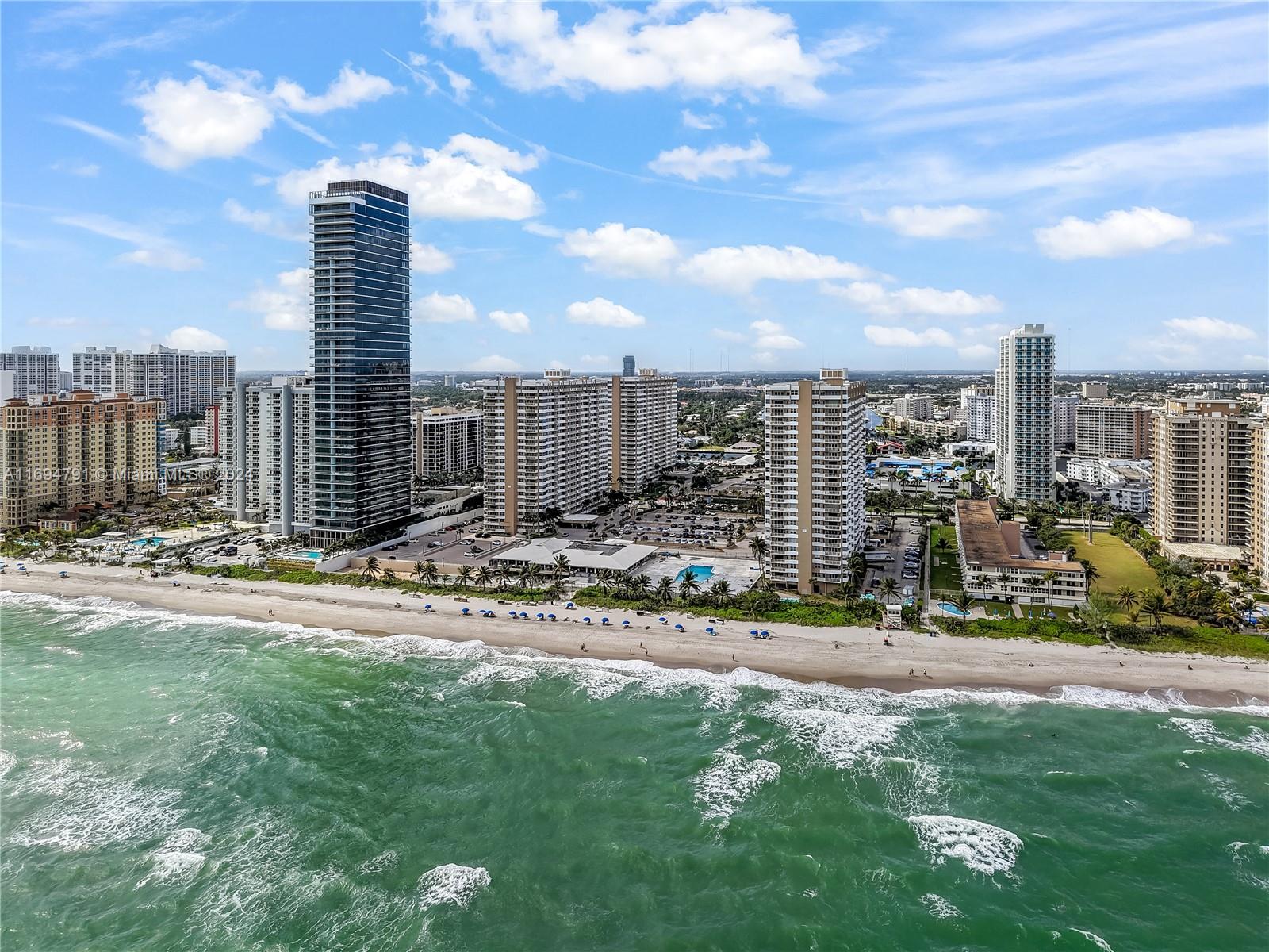 a view of a city with tall buildings