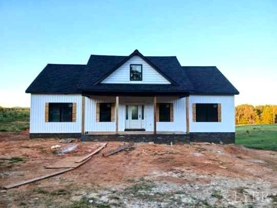 a front view of a house with yard