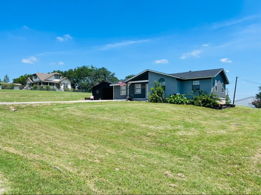 a view of a house with a big yard