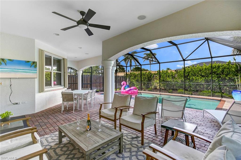 a view of a patio with a dining table and chairs