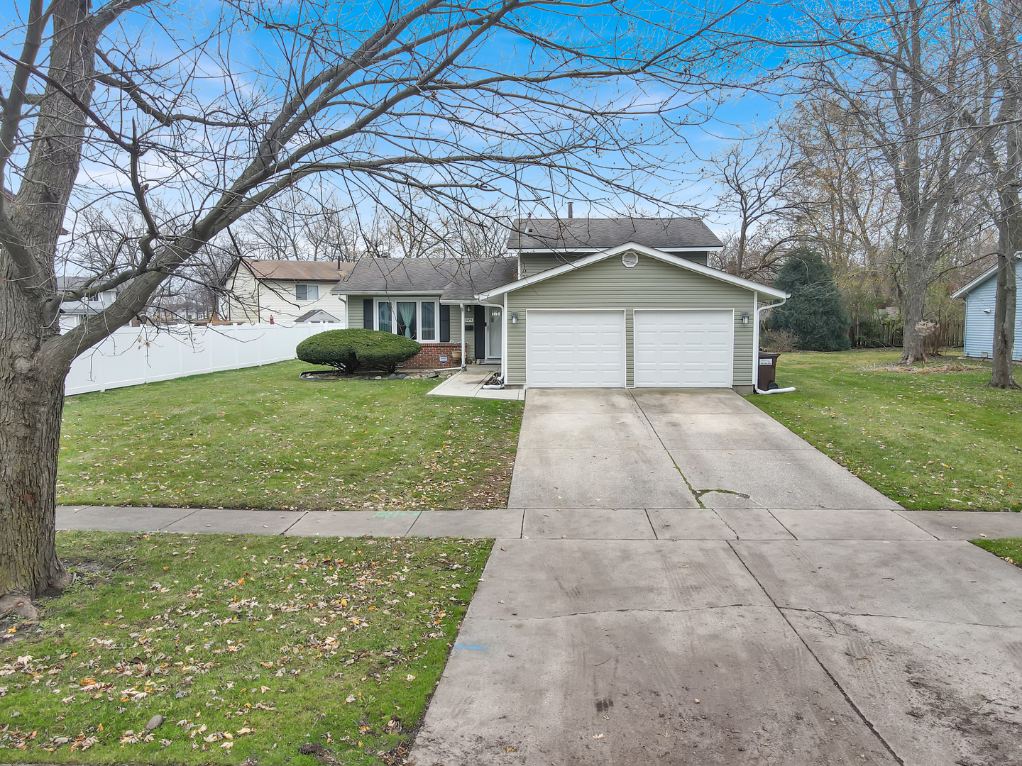 a front view of a house with yard