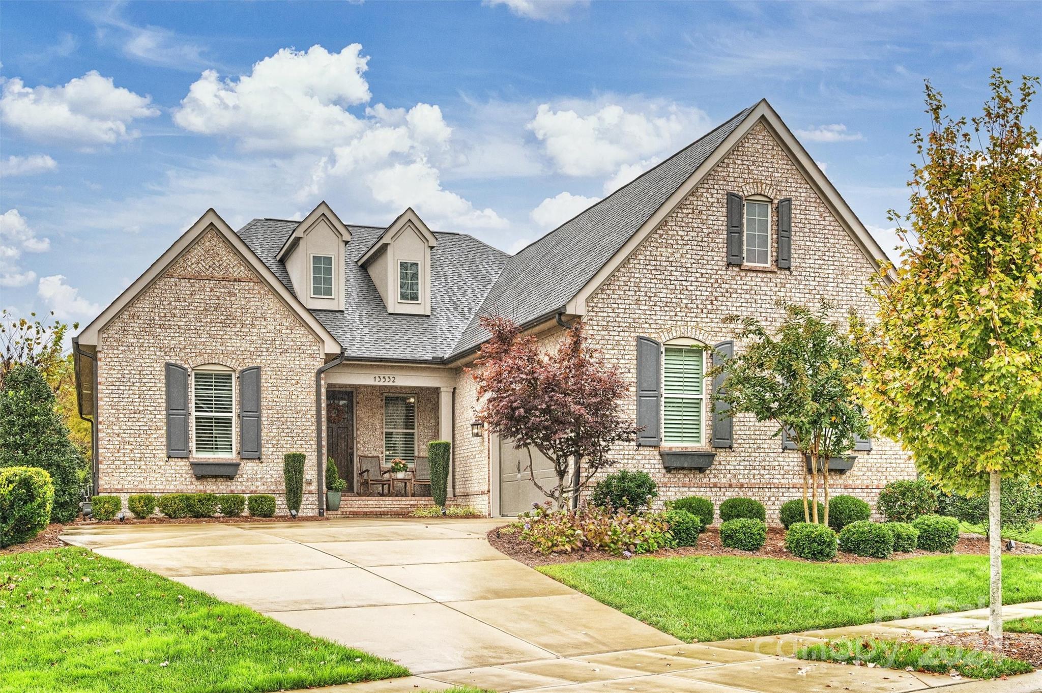 front view of a house with a yard