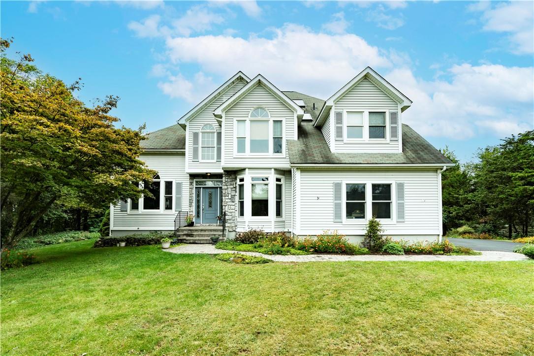 a front view of a house with a yard