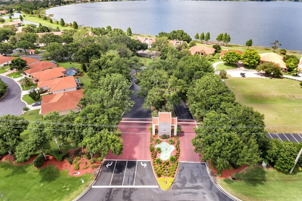 an aerial view of a house with a yard basket ball court and outdoor seating