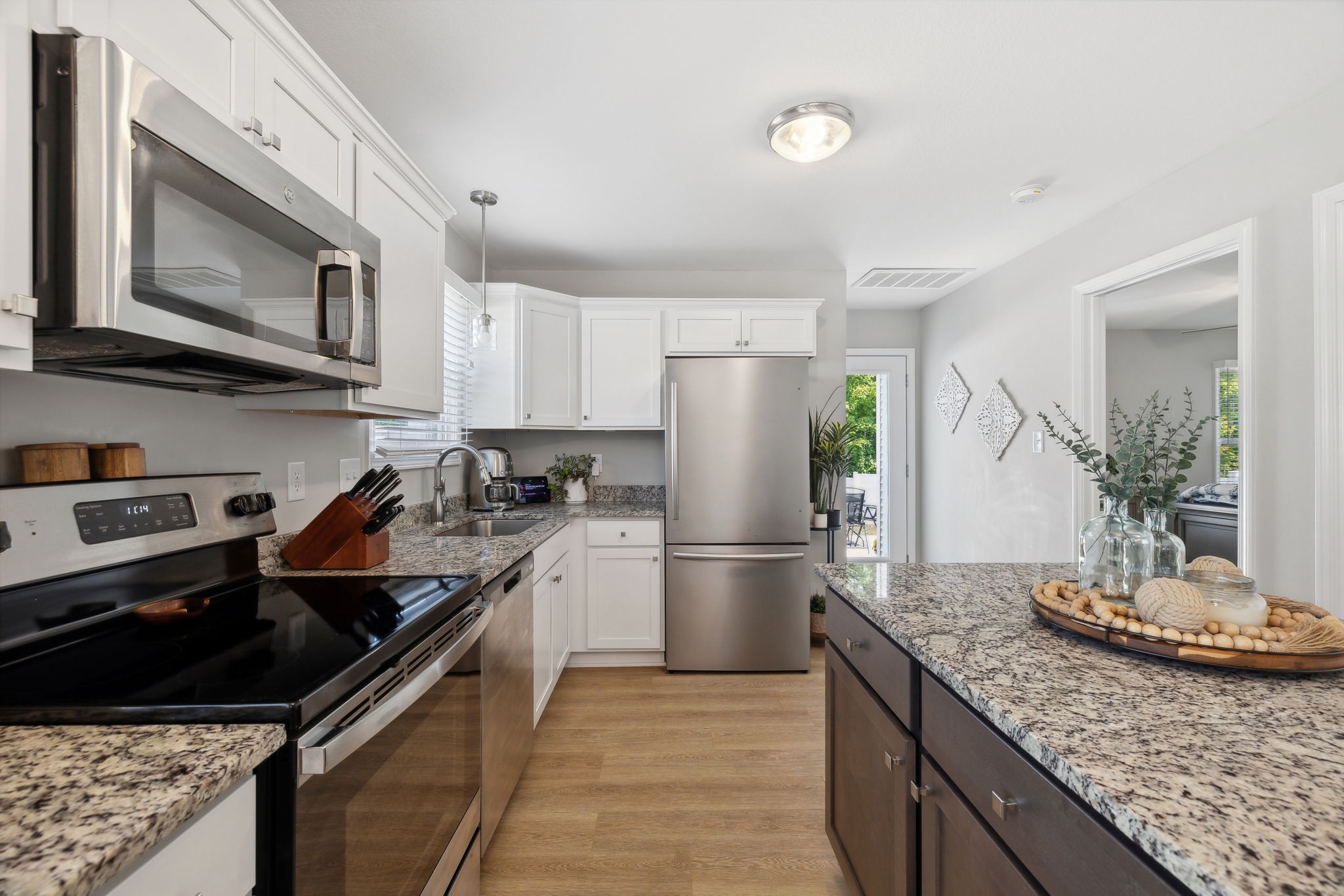 a kitchen with a sink stove and refrigerator