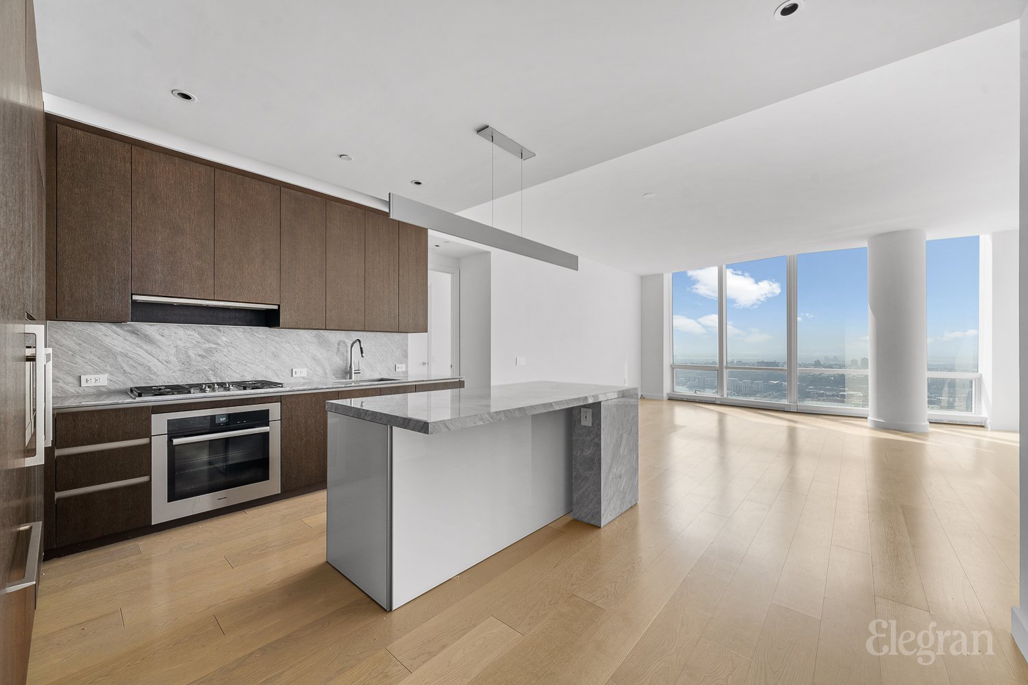 a kitchen with stainless steel appliances granite countertop a stove and a sink