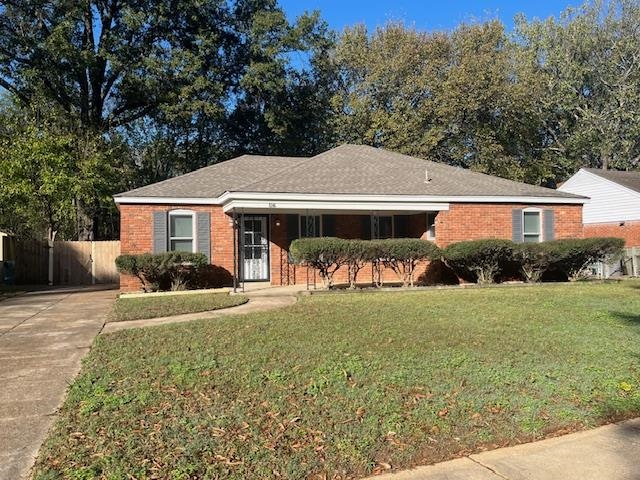 Ranch-style house with a front lawn