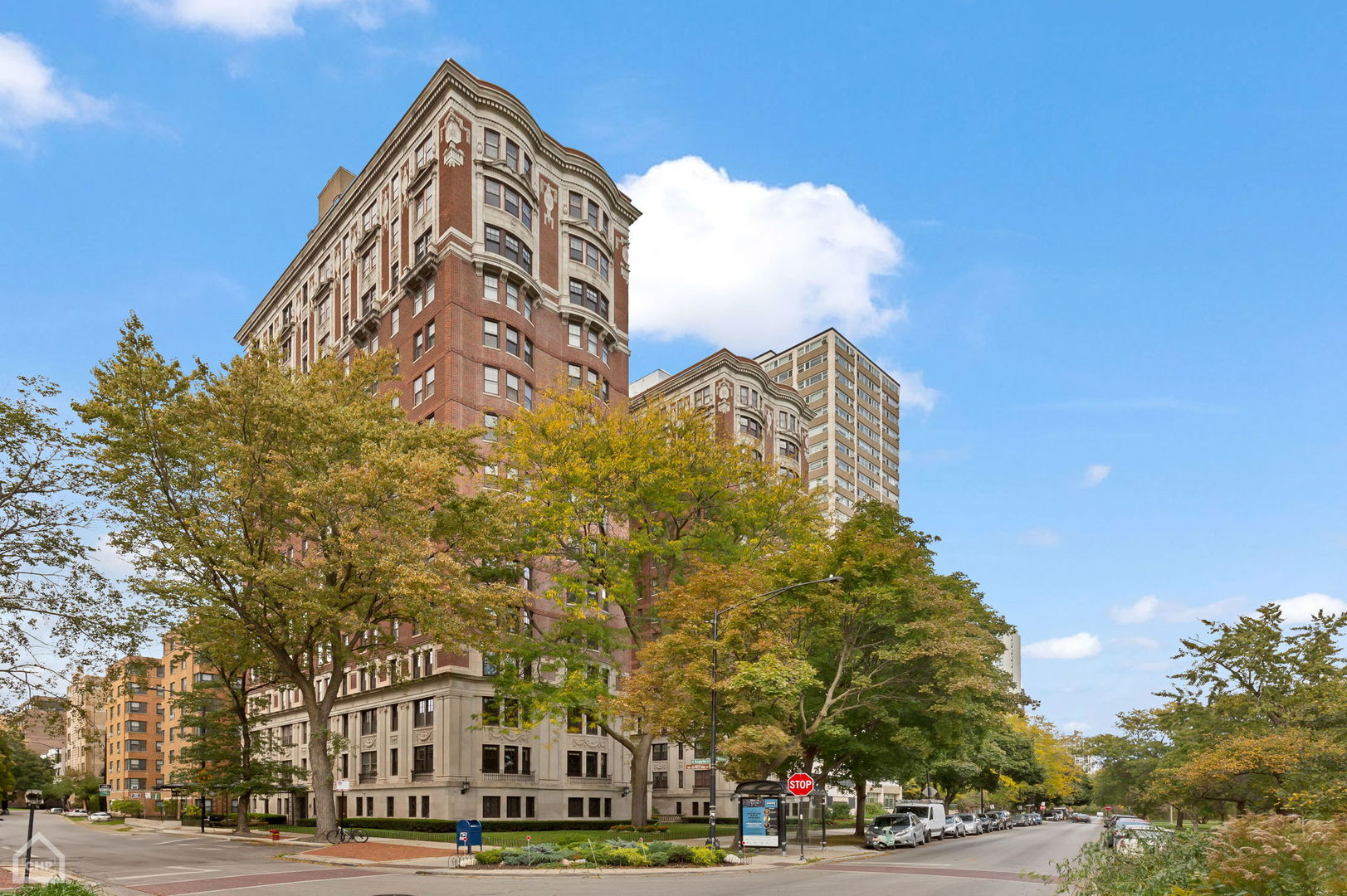 a view of a tall building next to a road