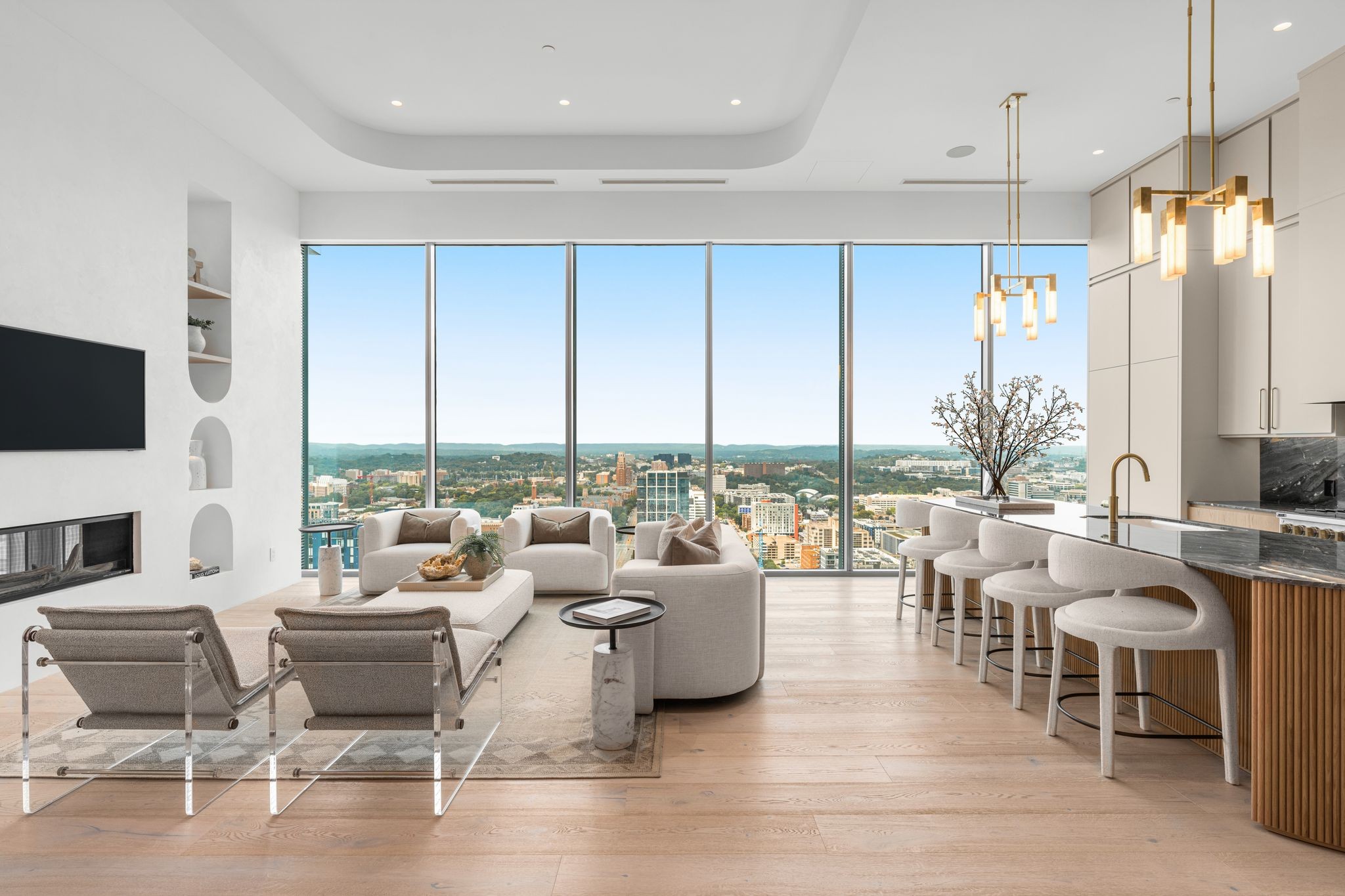 a living room with lots of furniture and a flat screen tv