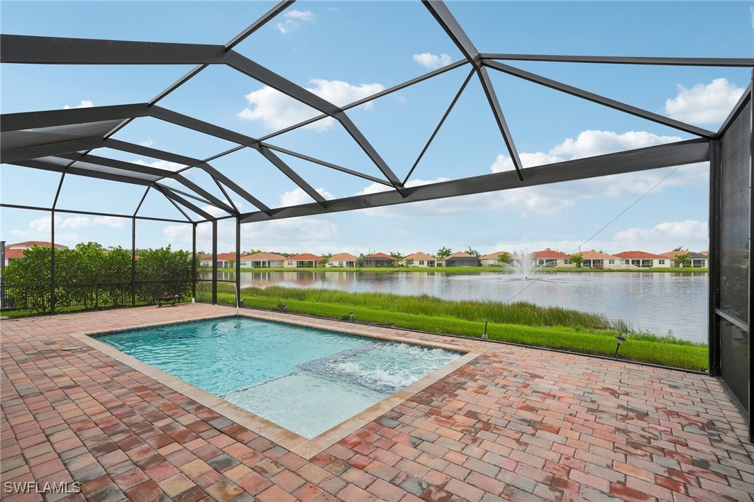 a view of a indoor swimming pool and a yard