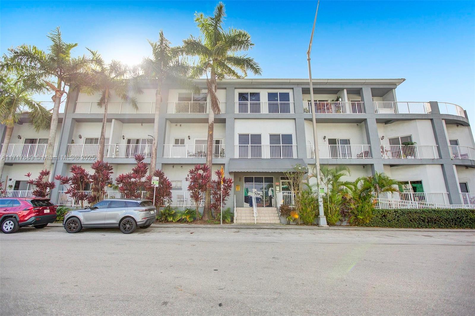 a group of cars parked in front of a building