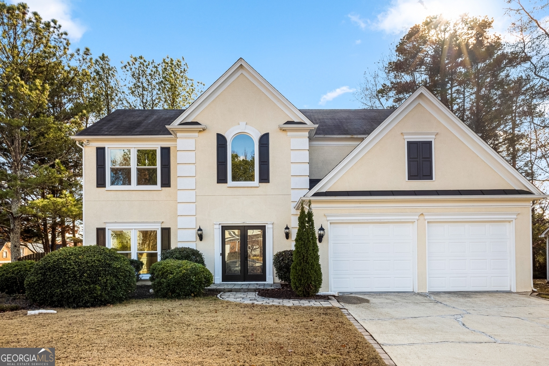 a front view of a house with a yard