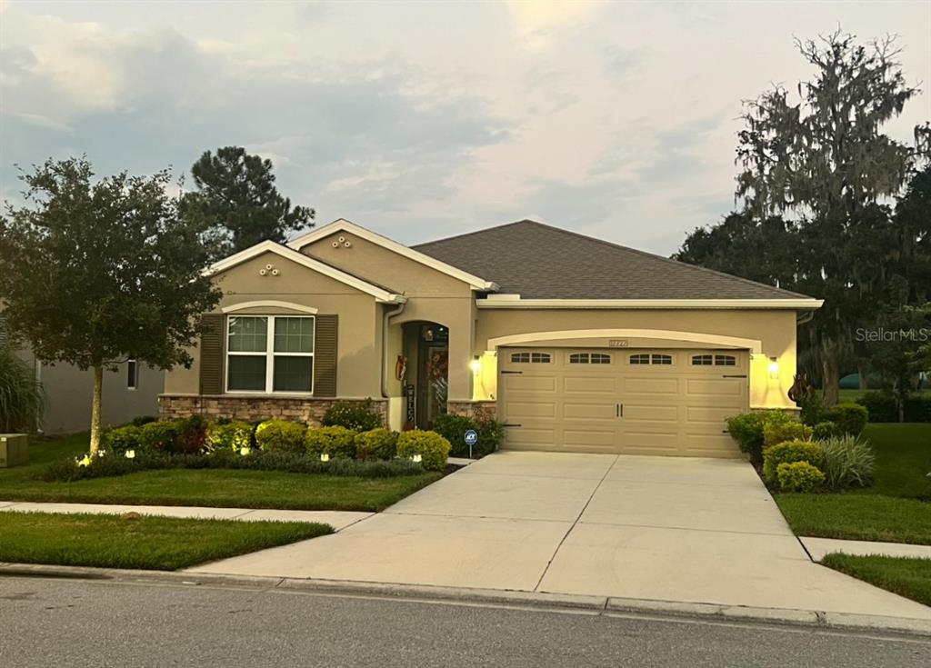 a front view of a house with garden