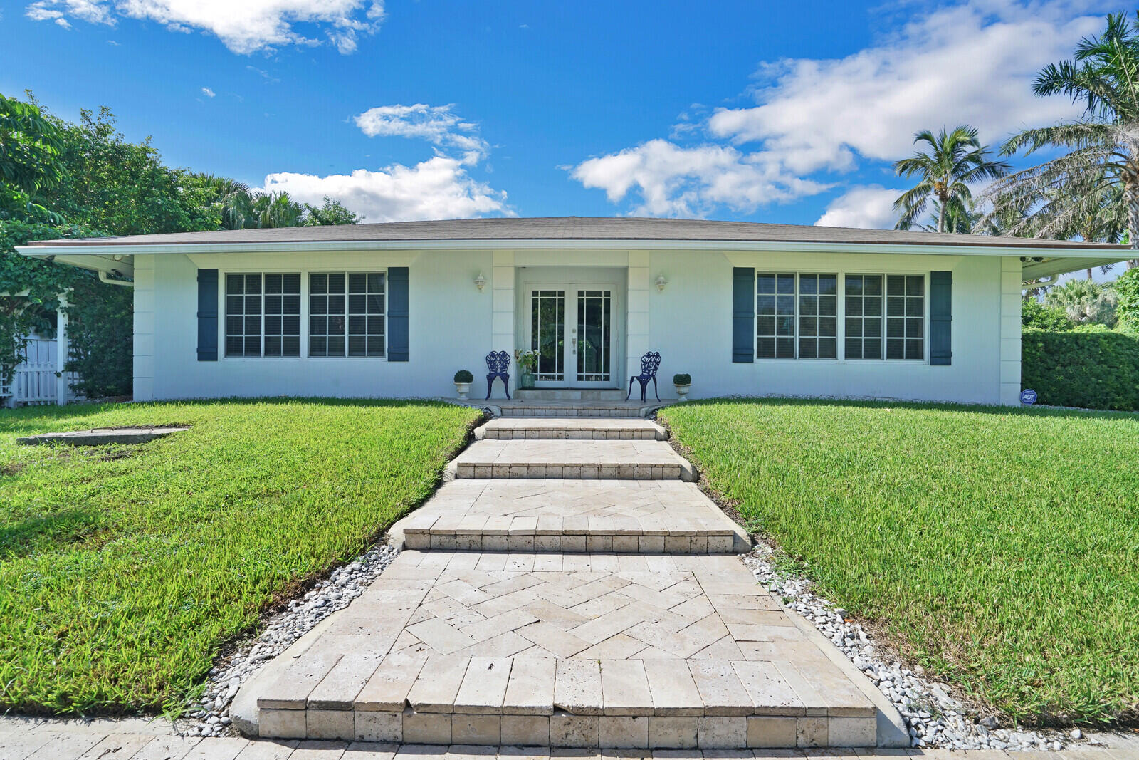 front view of a house with a yard