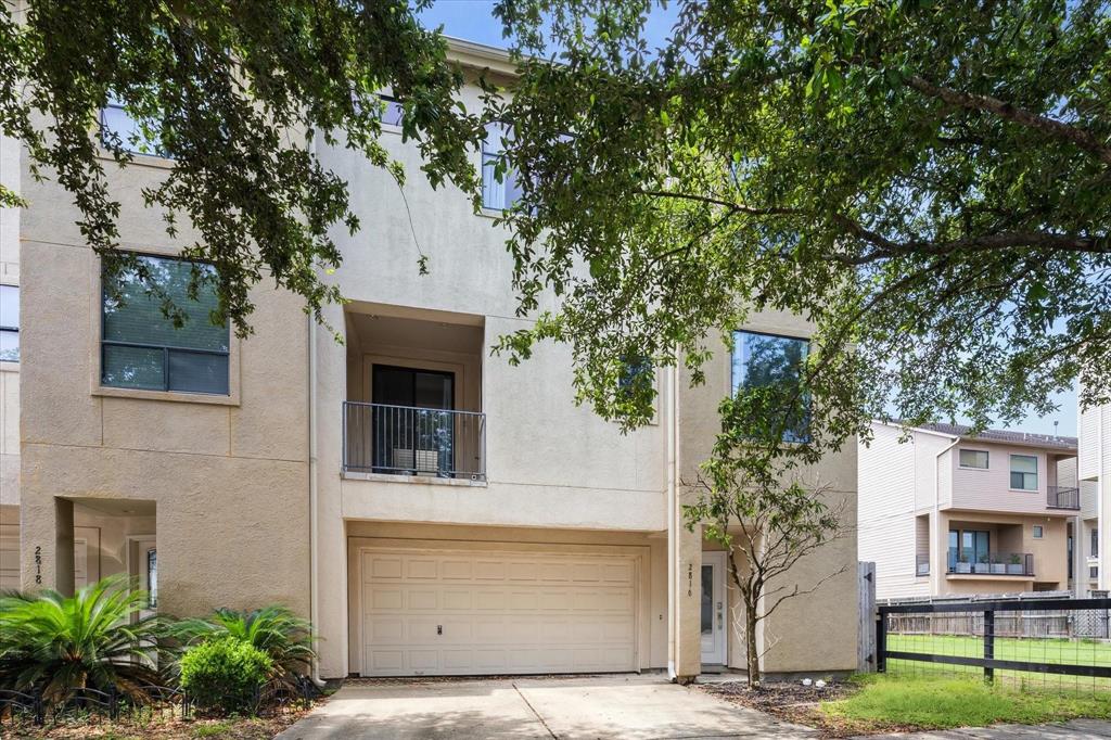 a front view of a house with garage