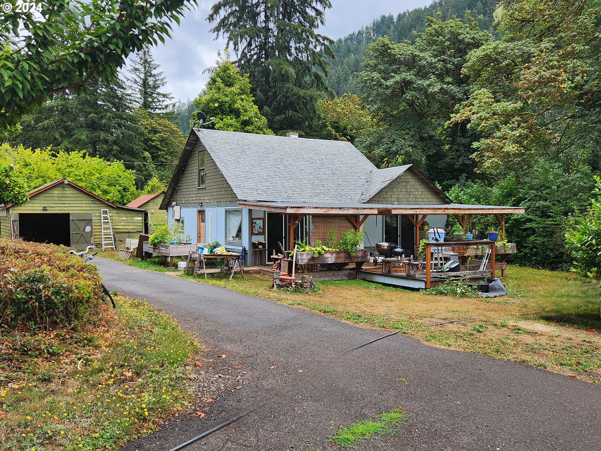 a view of a house with sitting area and garden