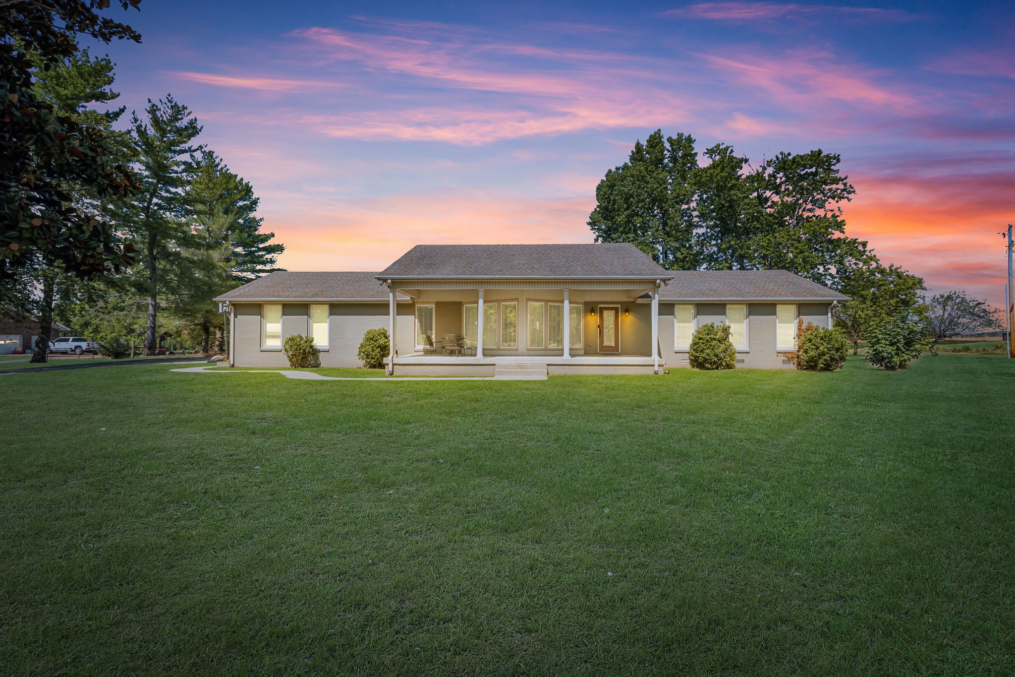 a front view of a house with a garden