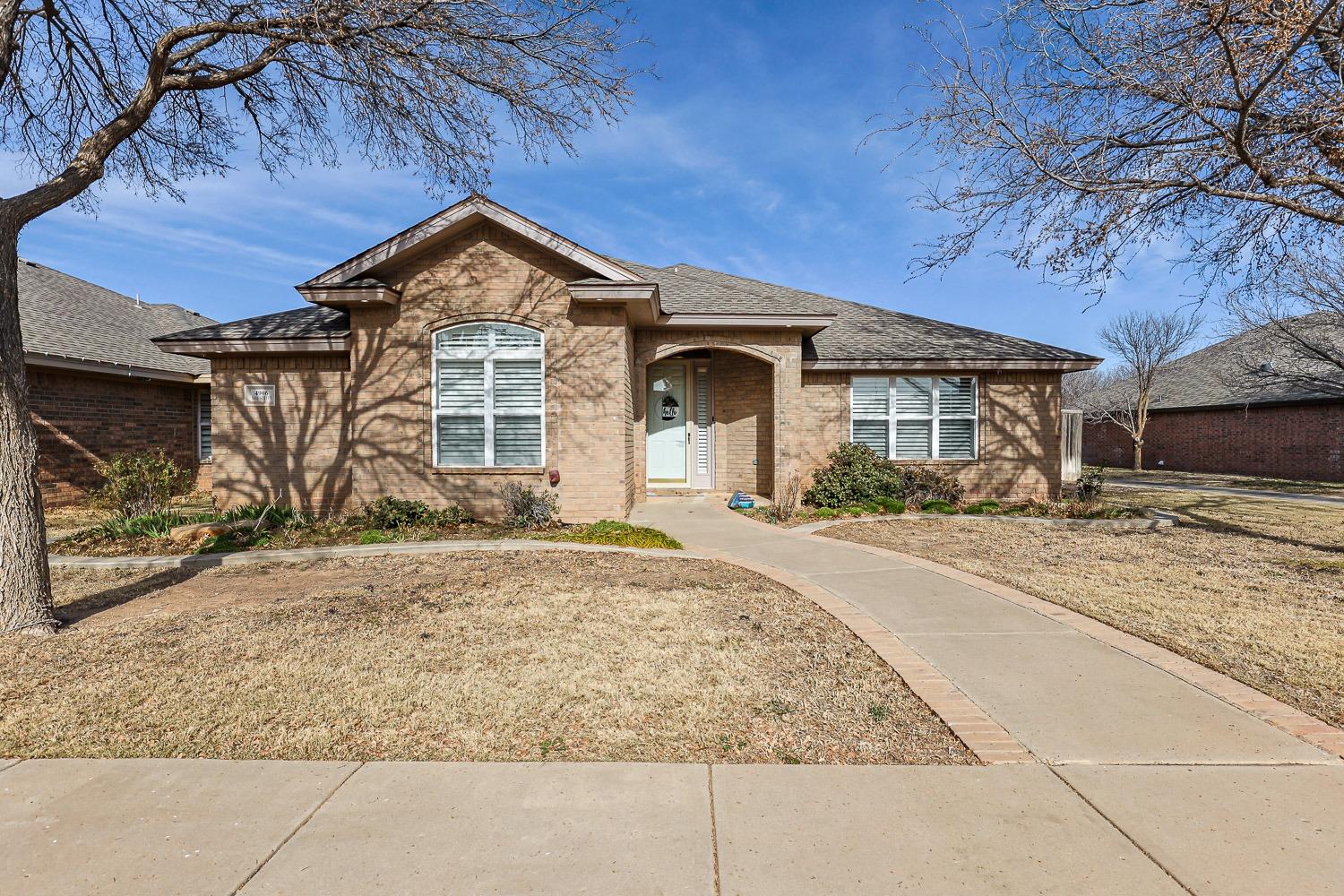 a front view of a house with yard