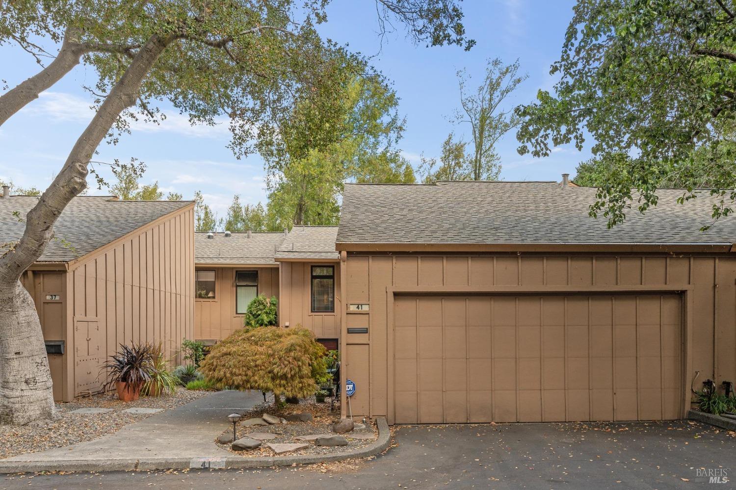 a view of a house with a tree