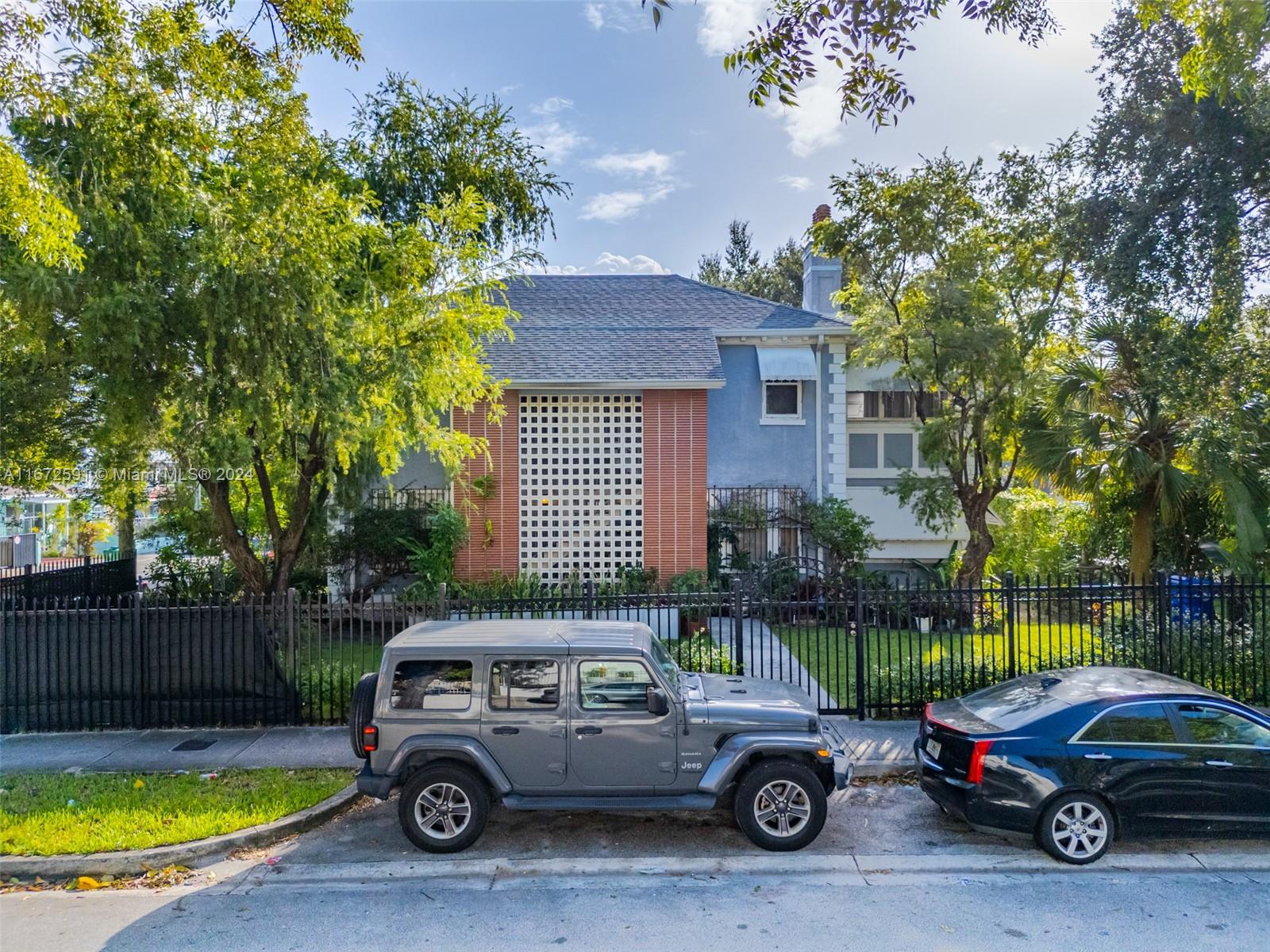 a car parked in front of a house