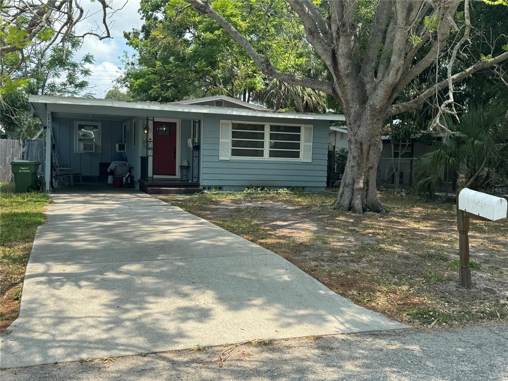 a view of a house with a yard