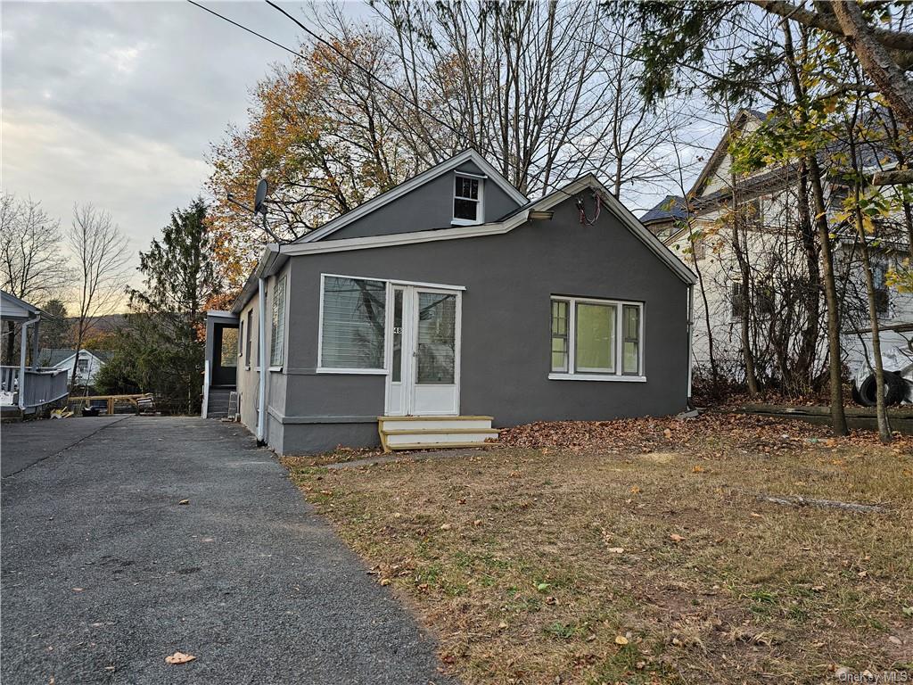 a house with trees in the background