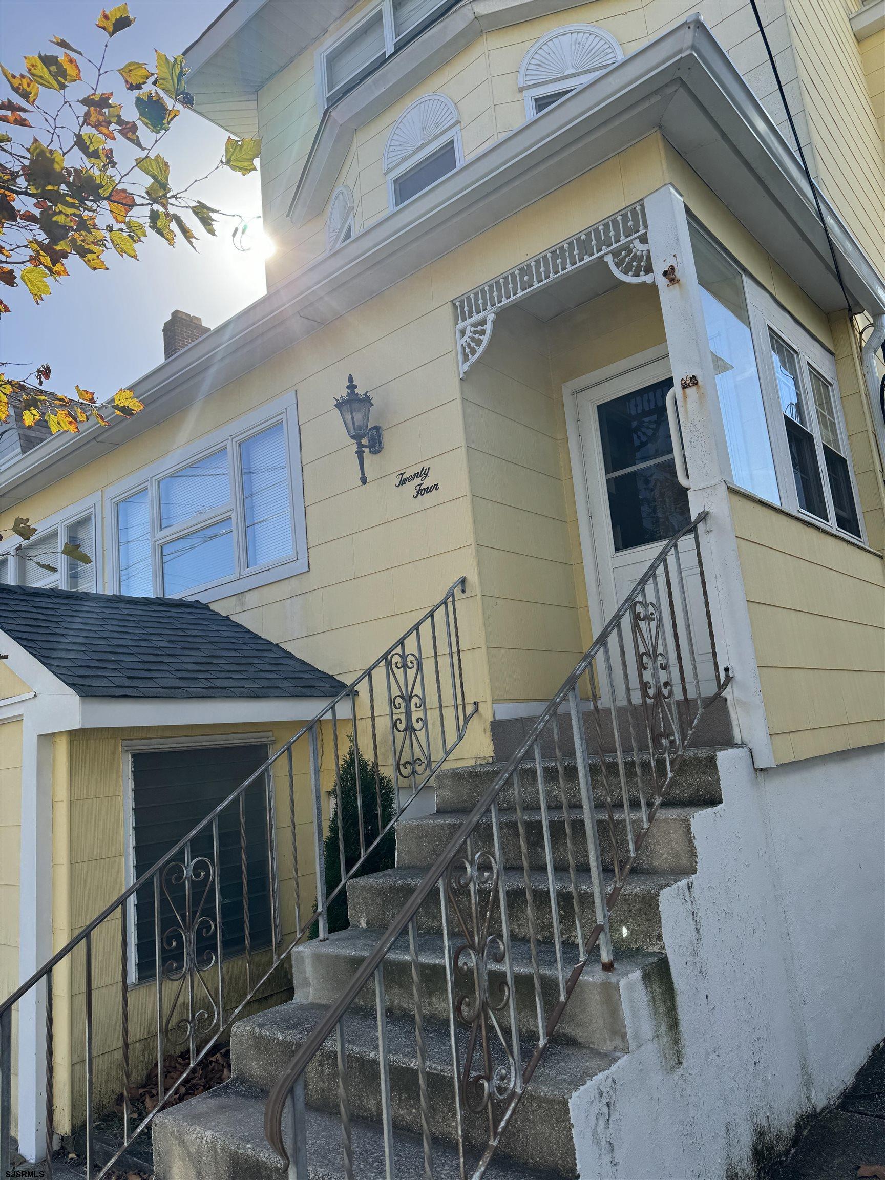 a view of entryway with wooden stairs