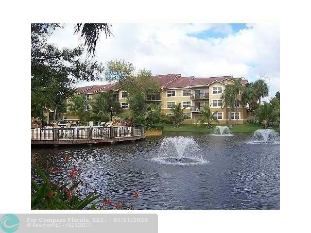 a view of a lake with a building in the background