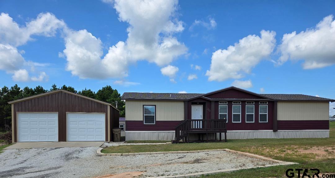 a view of a yard in front of a house