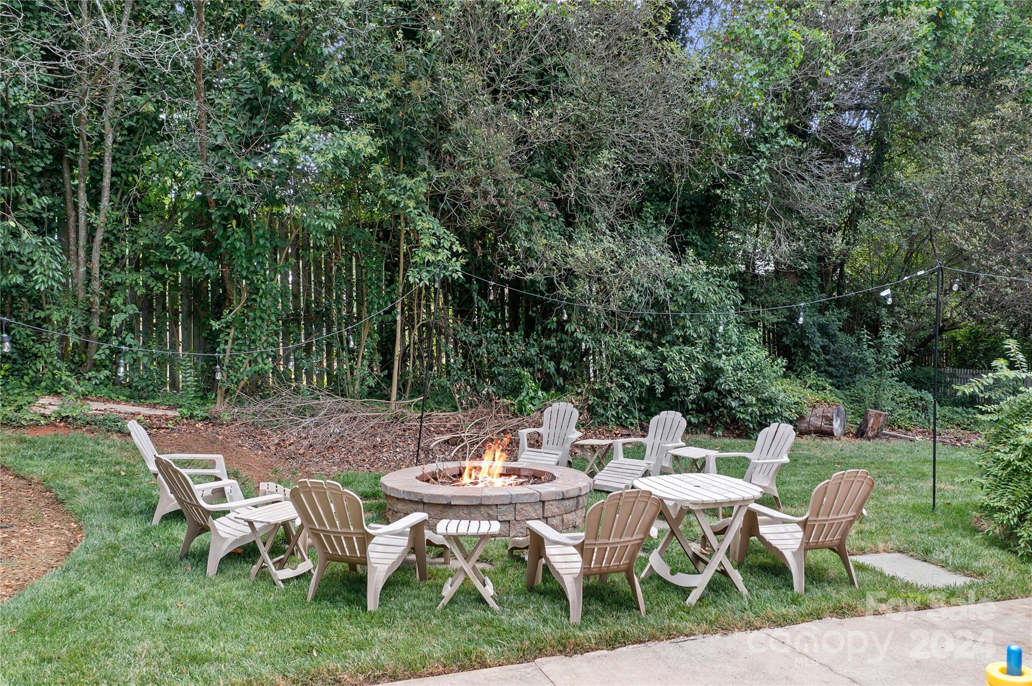 a view of a patio with table and chairs