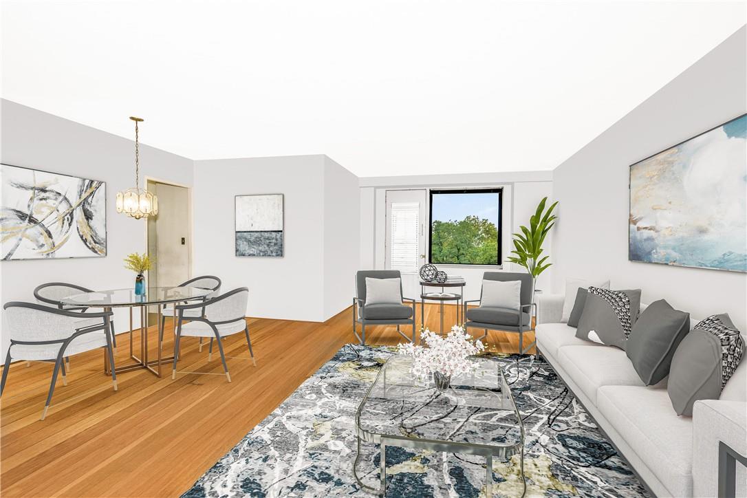 Living room featuring hardwood / wood-style flooring and a chandelier